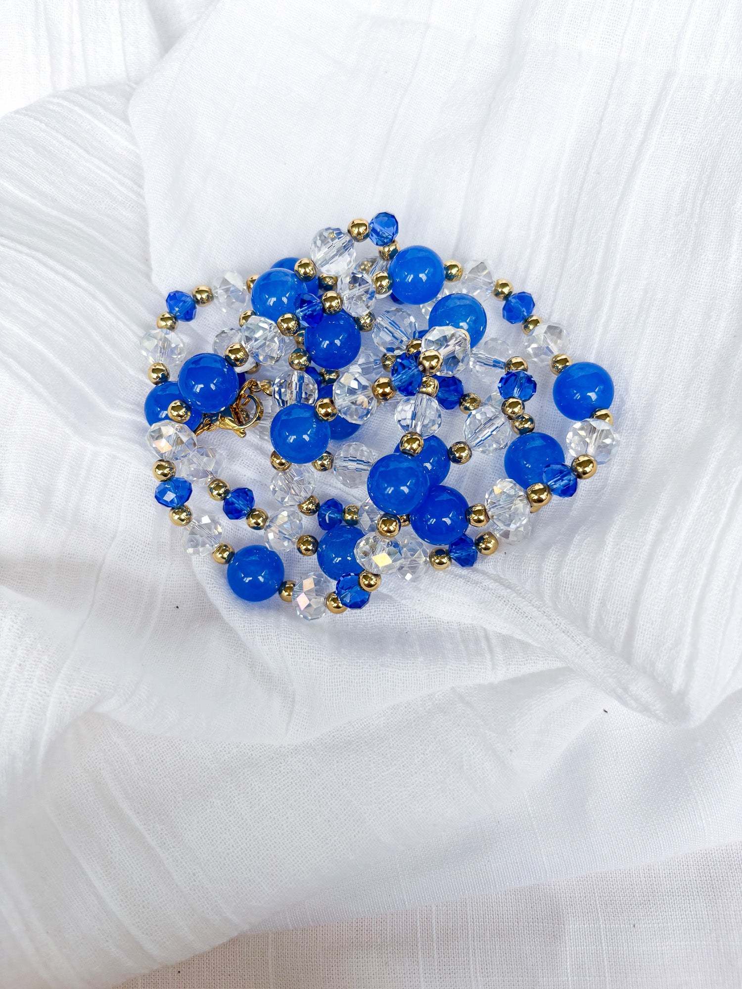 Handmade blue and clear faceted long Crystal Beaded Necklace with gold spacer beads - Beadsmith