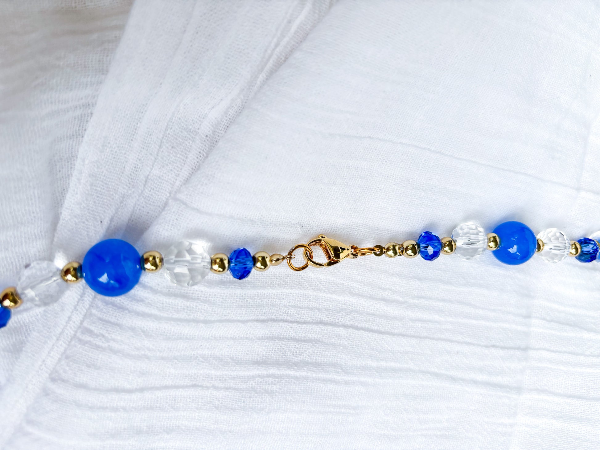 Handmade blue and clear faceted long Crystal Beaded Necklace with gold spacer beads - Beadsmith